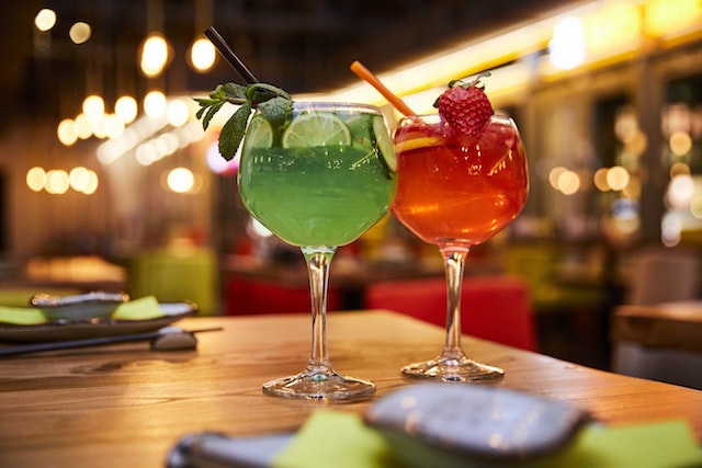 Two cocktails set on a table